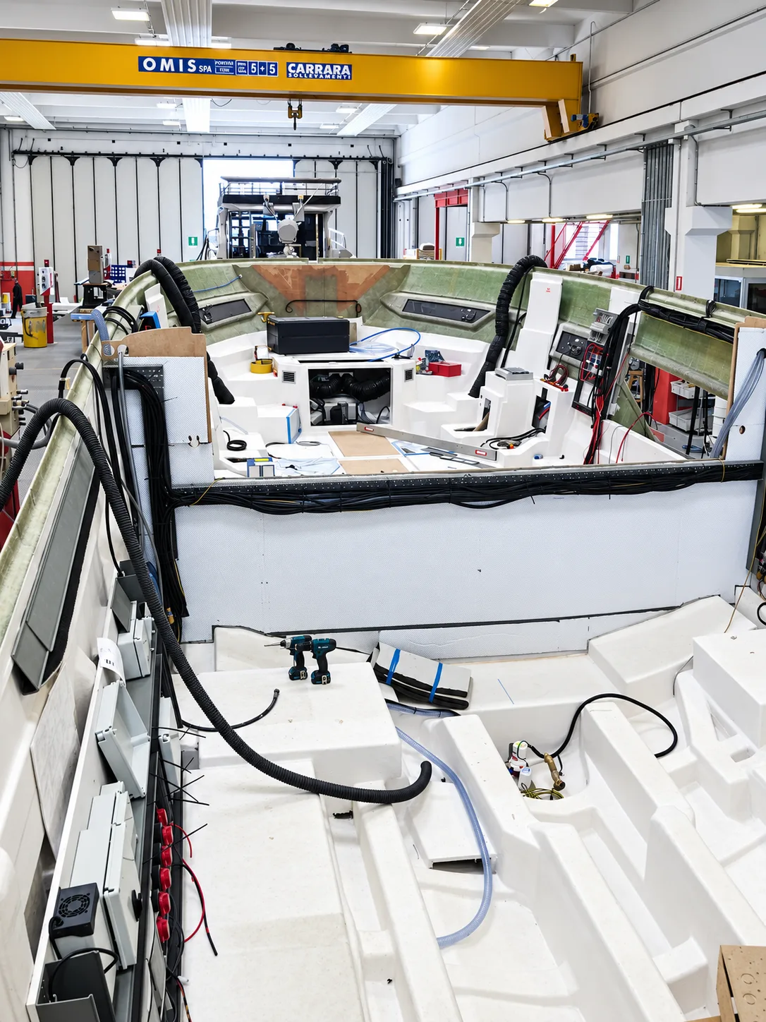 Systems installation inside a hull under construction