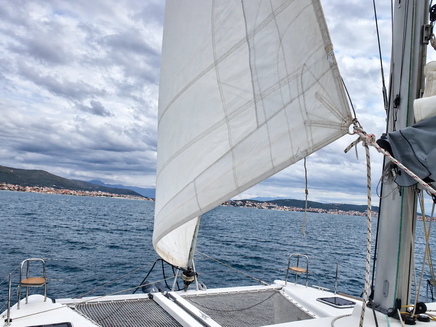 Sailing catamaran under sail during a pre-purchase survey in the Adriatic