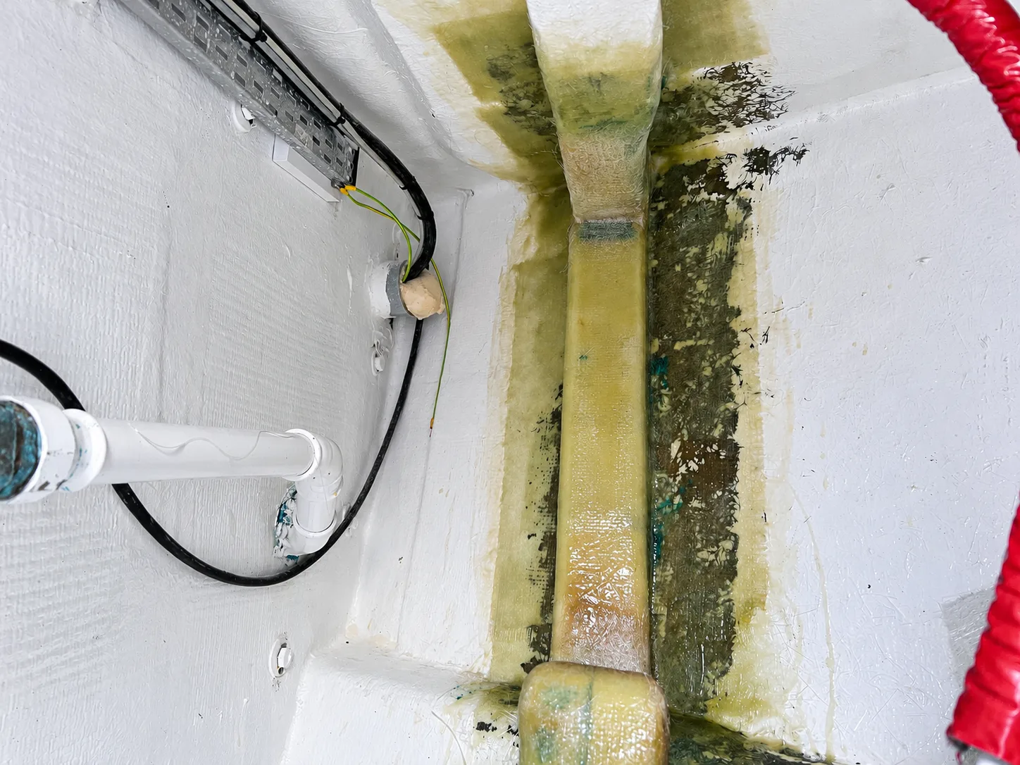 Internal stringer and laminate examined during a yacht hull inspection